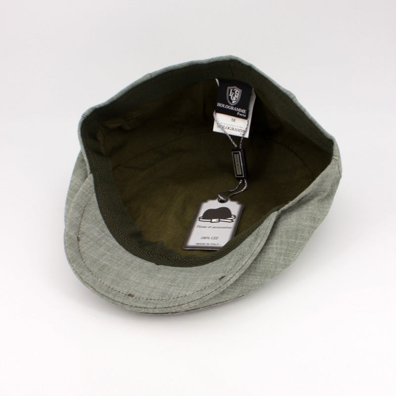 Green cap with a tag on a white background
