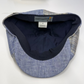 Blue denim cap with black interior on a white background