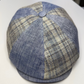 Blue and beige checkered cap on a white surface