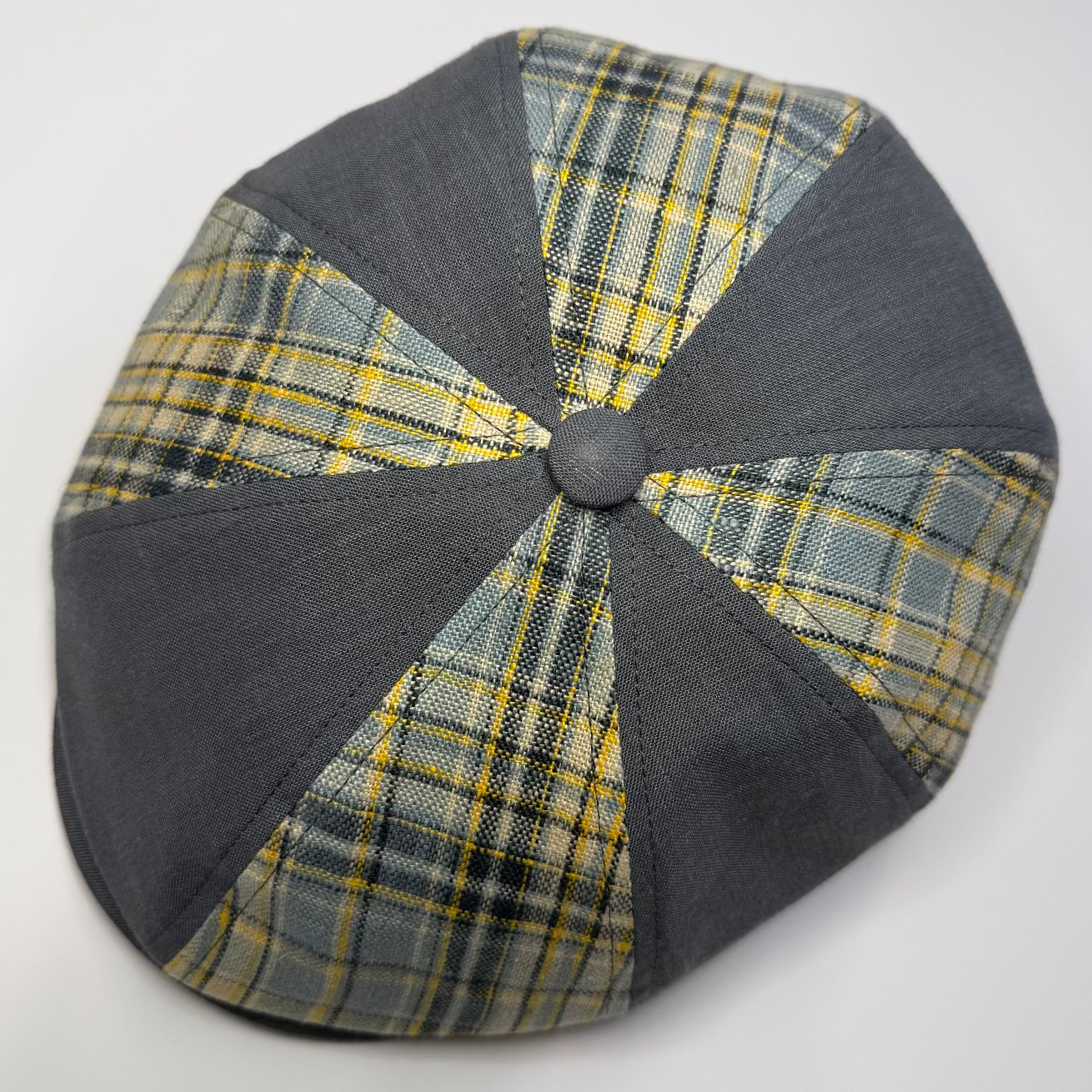 Plaid beret with gray trim on a white background