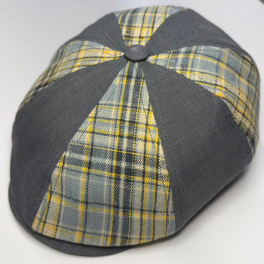 Plaid patterned cap with gray base on a white background