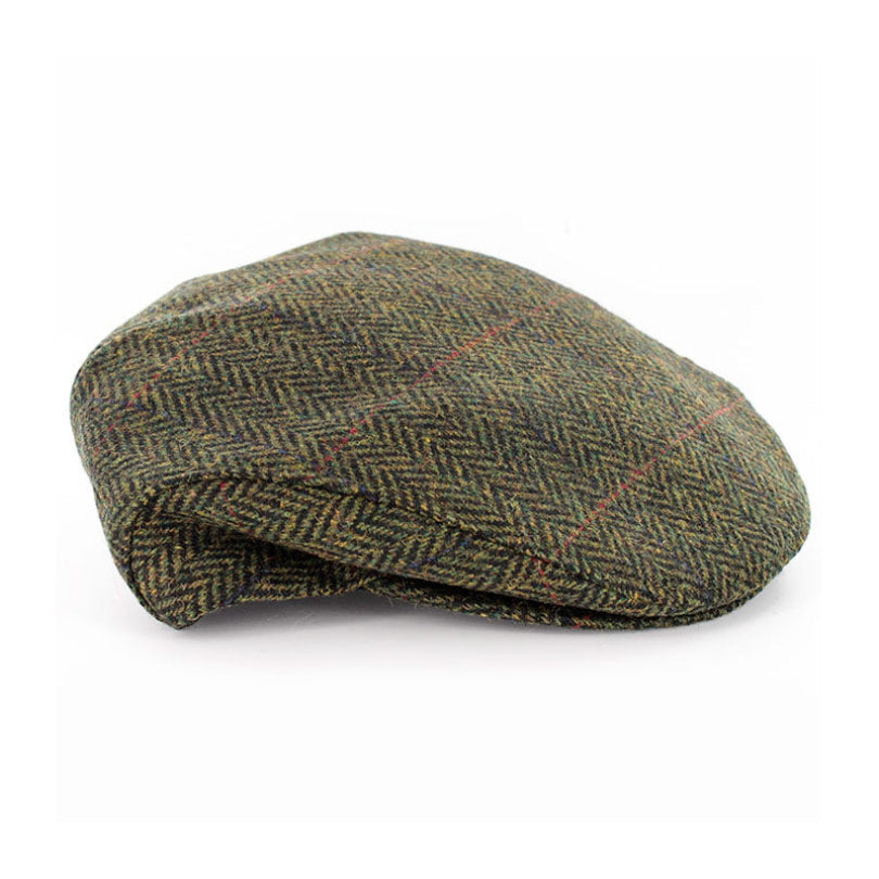 A classic flat cap in a green and brown herringbone tweed pattern with subtle red and yellow plaid lines, shown on a plain white background.