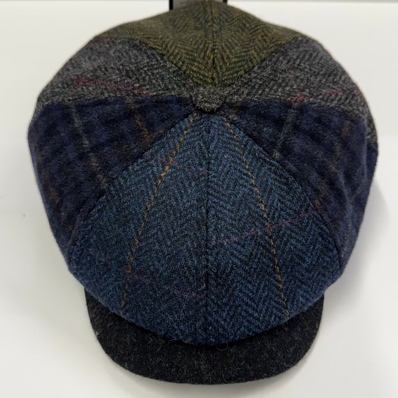 Woven patterned cap on a white background
