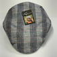 Plaid flat cap with a brand label on a white background