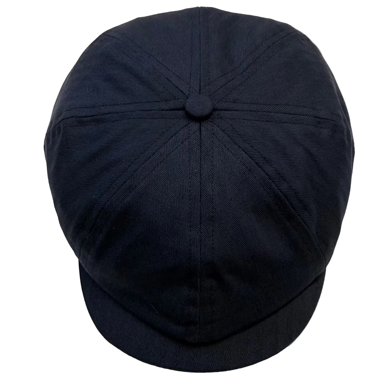 A dark navy blue newsboy cap with a structured six-panel crown and a curved brim, photographed from a top-down angle on a light off-white background.