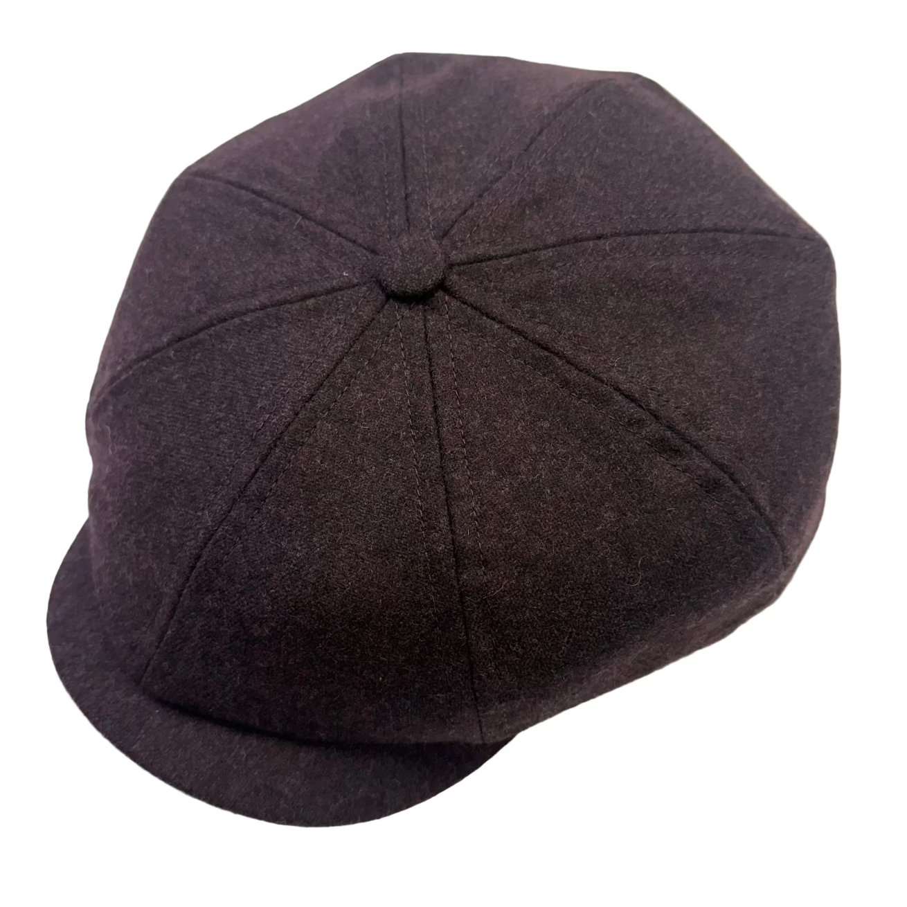 A dark plum purple woolly newsboy cap with a curved brim, photographed from a high angle on a light gray background.