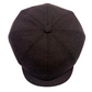 A dark brown wool flat cap with a buttoned top and short brim, photographed from a top-down angle on a white background.