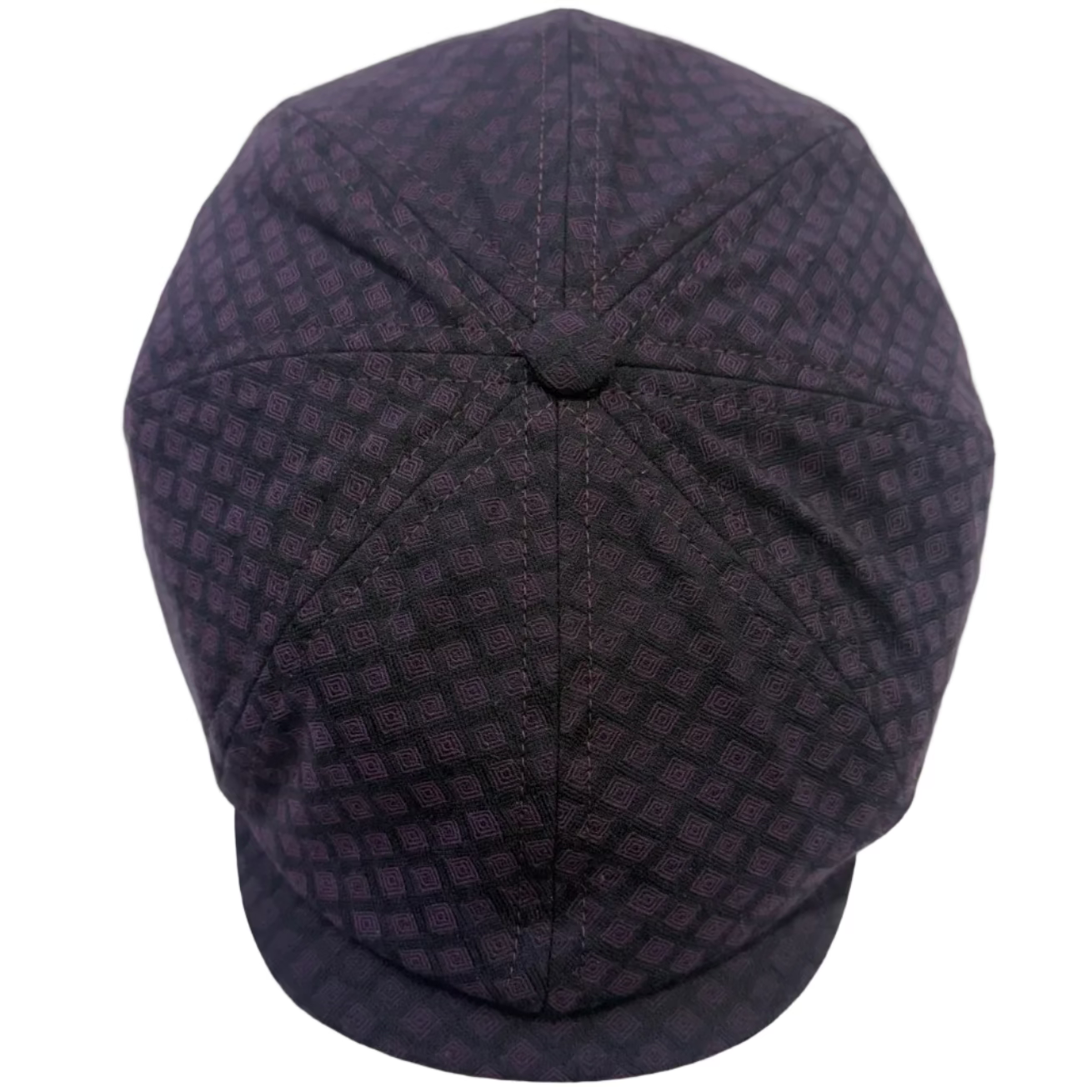 A dark purple and black patterned newsboy cap photographed from a top-down angle on a white background.