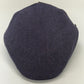A dark purple herringbone pattern flat cap, photographed from a top-down angle on a plain white background.