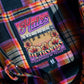 The fabric tag inside the women's Redondo flannel with orange flowers and a beach scene.