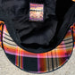 Underside of Newsboy cap with flannel underbrim in orange and black.