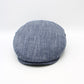 A blue and white textured flat cap, also known as a newsboy cap, shown from a front-three-quarter angle on a white studio background.