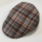 Plaid patterned cap on a white background