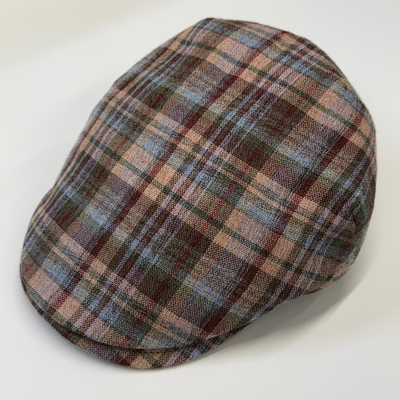 Plaid patterned cap on a white background