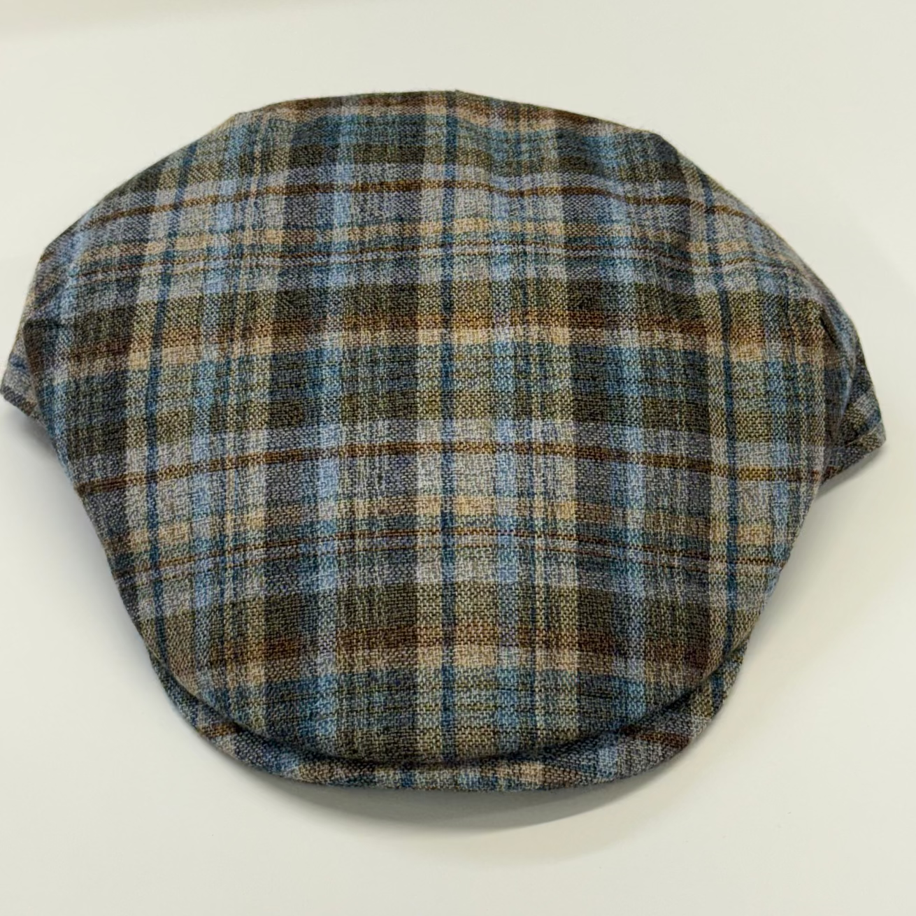 Plaid patterned cap on a white background