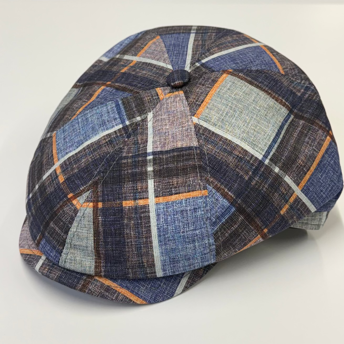 Plaid patterned cap on a white background