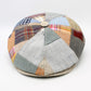 Patchwork cap with multicolored fabric pieces on a white background