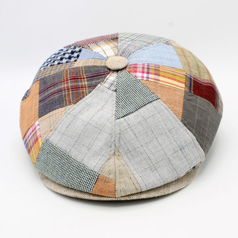 Patchwork cap with multicolored fabric pieces on a white background