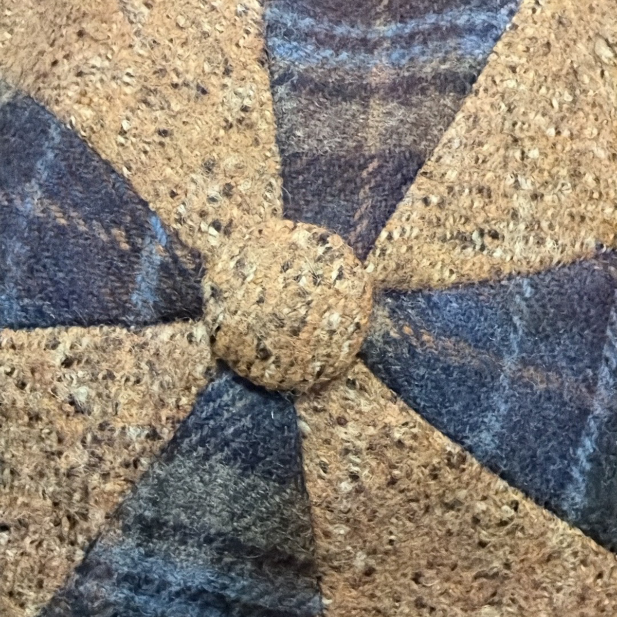 Close-up of the camel flecked and navy plaid fabrics used in the da Vinci Newsboy by FunkyBrims.