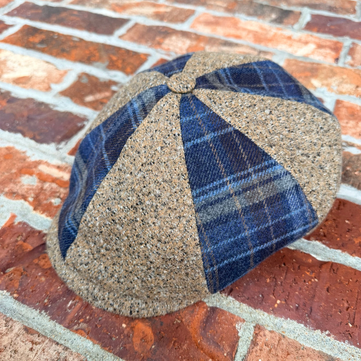 Three-quarter product view of the Masterpiece da Vinci Newsboy Cap by FunkyBrims with alternating flecked and navy plaid panels.