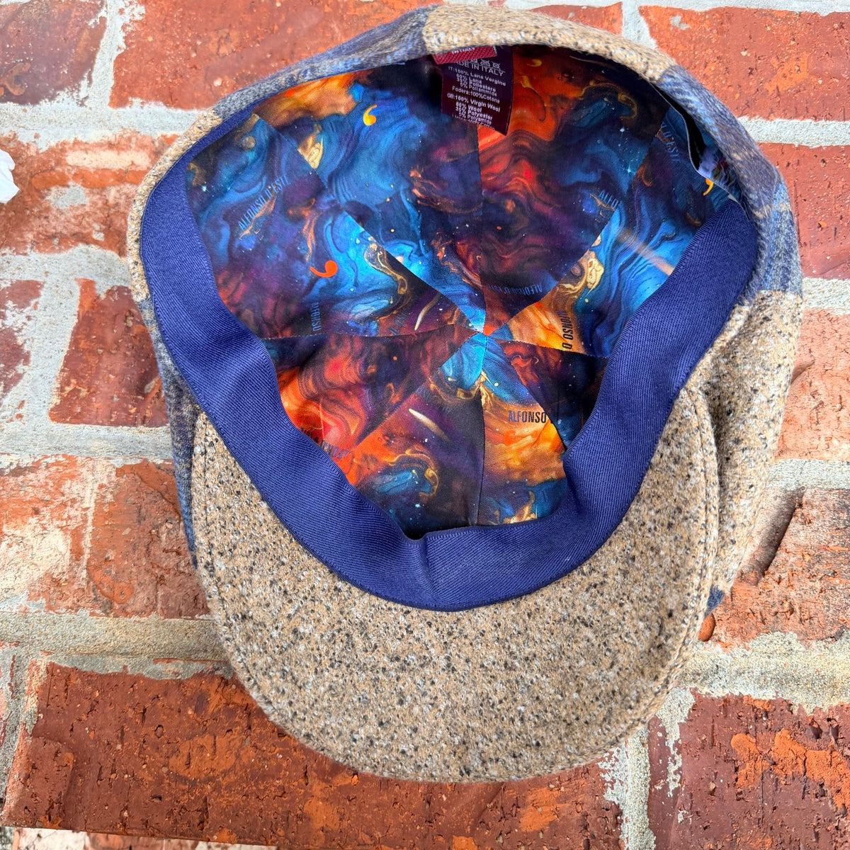 Interior view of the Masterpiece da Vinci Newsboy Cap by FunkyBrims, showing the colorful illustrated lining.