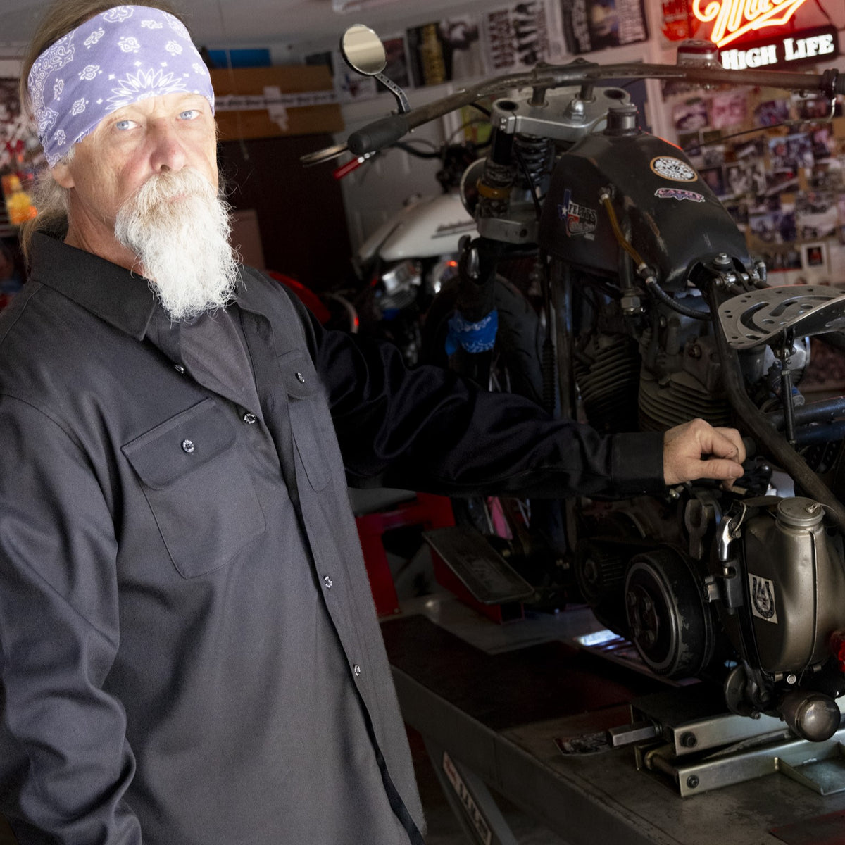 Black Blue Collar long sleeve shirt worn beside a motorcycle