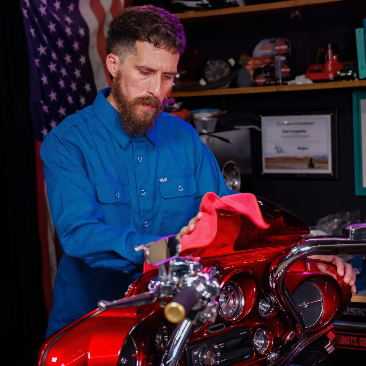 Hales Deep Teal Blue Collar long sleeve shirt worn while polishing a motorcycle