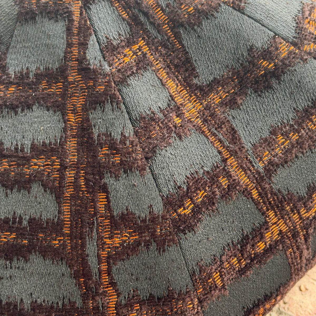 Close-up of RazorClaw raised black pattern and orange threads