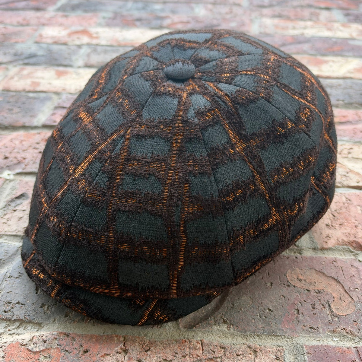 RazorClaw black and orange newsboy cap by Alfonso d’Este x FunkyBrims, angled front view