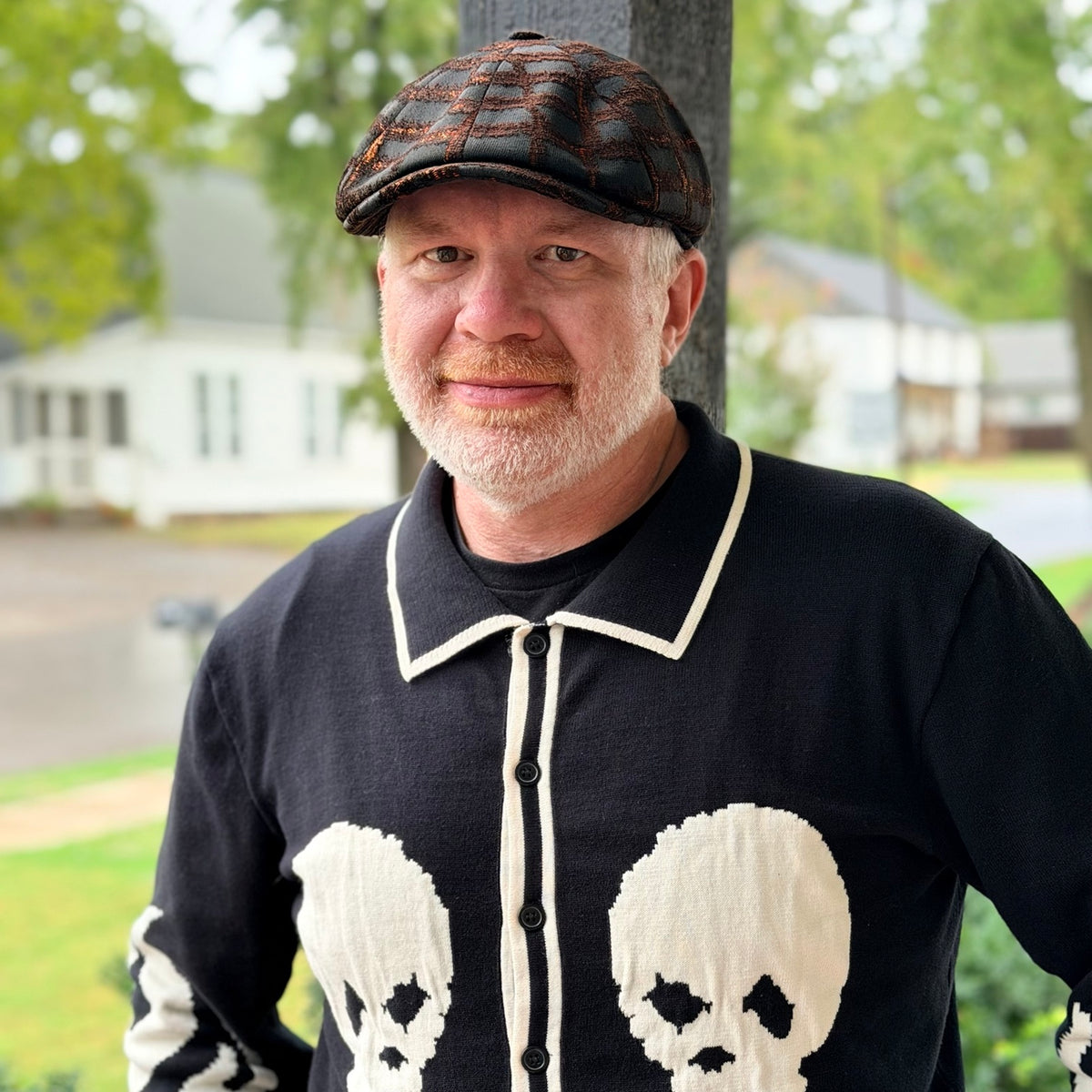 RazorClaw black and orange newsboy cap worn outdoors