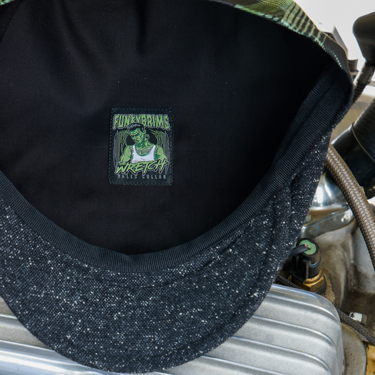 Wretch flannel flat cap interior with black lining and collaboration label