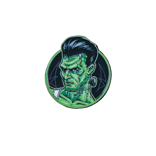 Wretch enamel pin shown attached to the green plaid flat cap