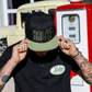 Model wearing the Wretch snapback and black Wretch tee
