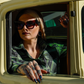 Women's Wretch flannel worn beside a vintage truck window