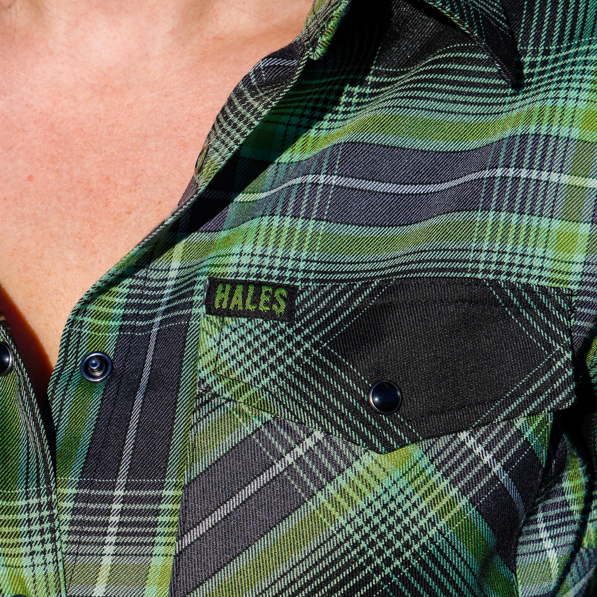 Women's Wretch flannel chest pocket and Hales label